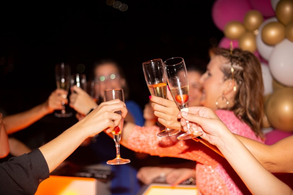 A group of women are drinking champagne at a birthday party.